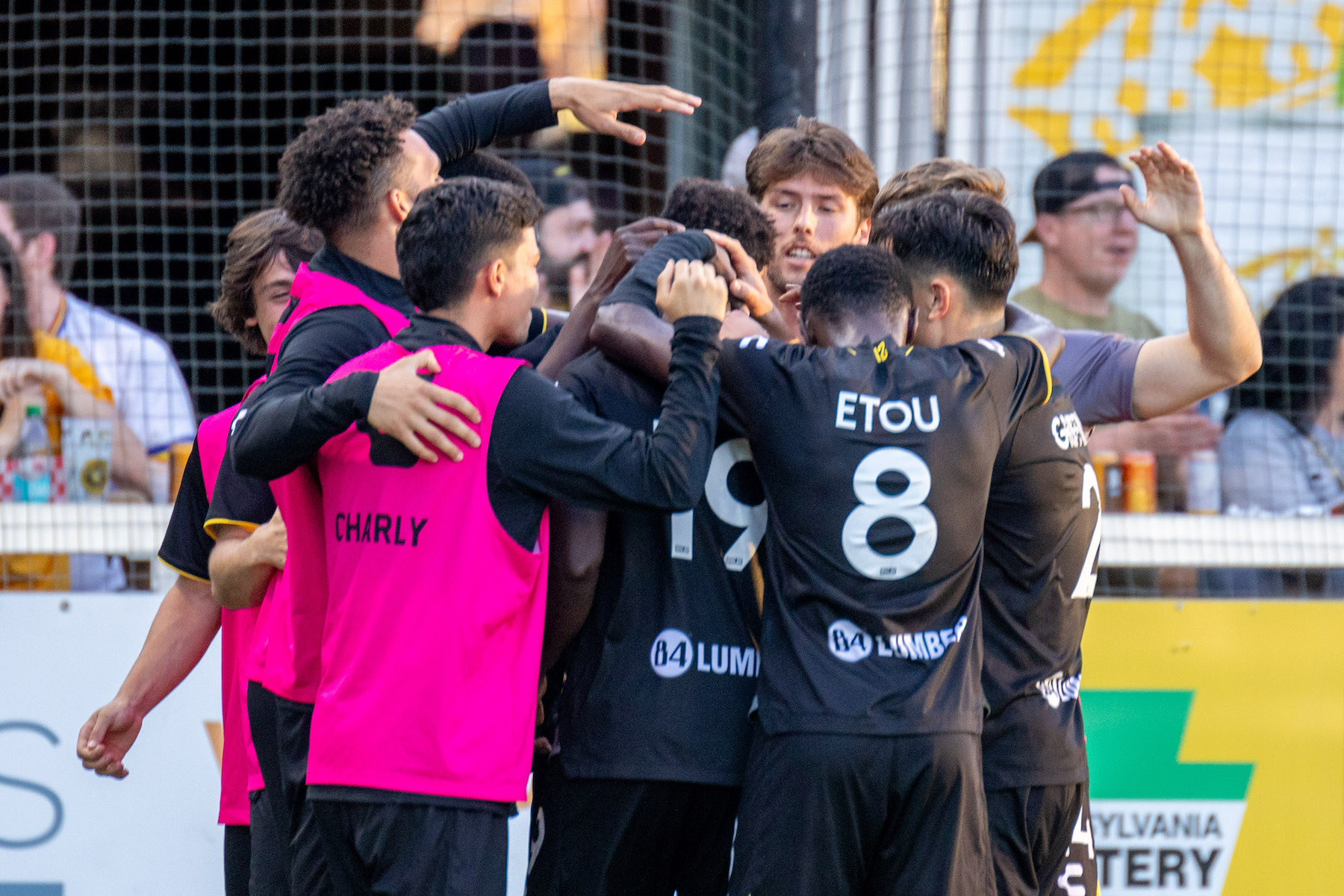 Hounds players celebrate Edward Kizza's goal against North Carolina FC on May 18, 2024 at Highmark Stadium. (Photo: Chris Cowger/Riverhounds SC)