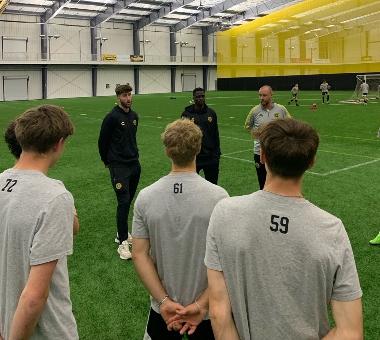 Hounds pro team players Pat Hogan and Babacar Diene visit with the Hounds' 2007 Boys ECNL team during training at AHN Montour.