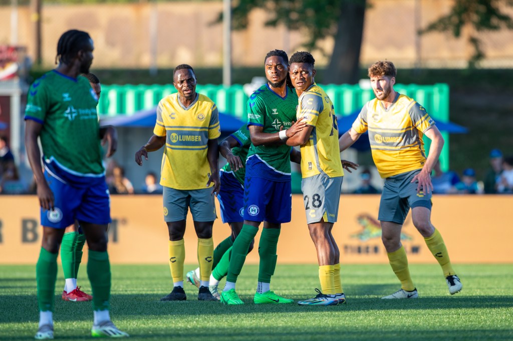 (From left) Edward Kizza, Illal Osumanu and Pat Hogan set up to defend a corner kick in the Hounds' 2-0 loss to Hartford Athletic on June 15, 2024 at Trinity Health Stadium in Hartford, Conn. (Photo: Hartford Athletic)