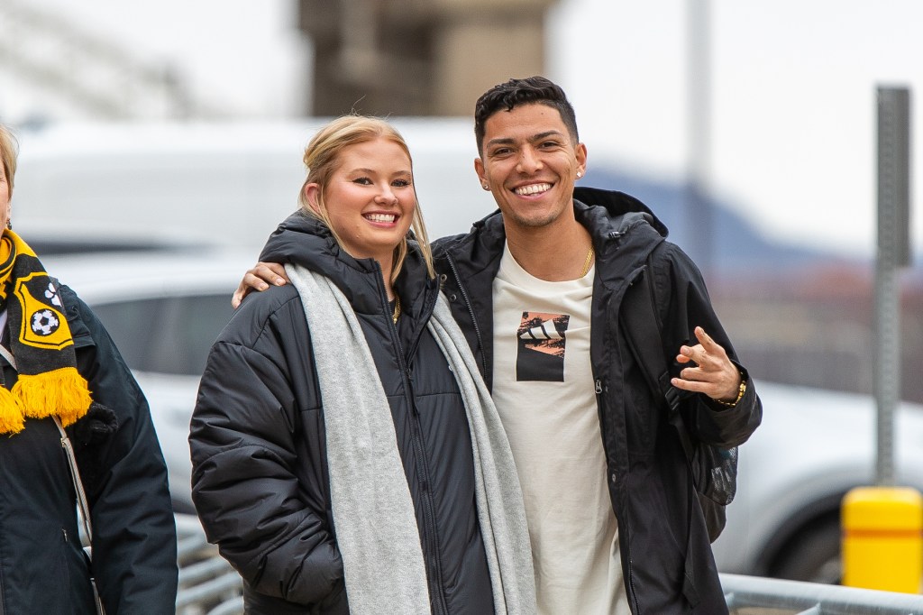 Dani and his wife posing for a picture before a Pittsburgh Riverhounds match