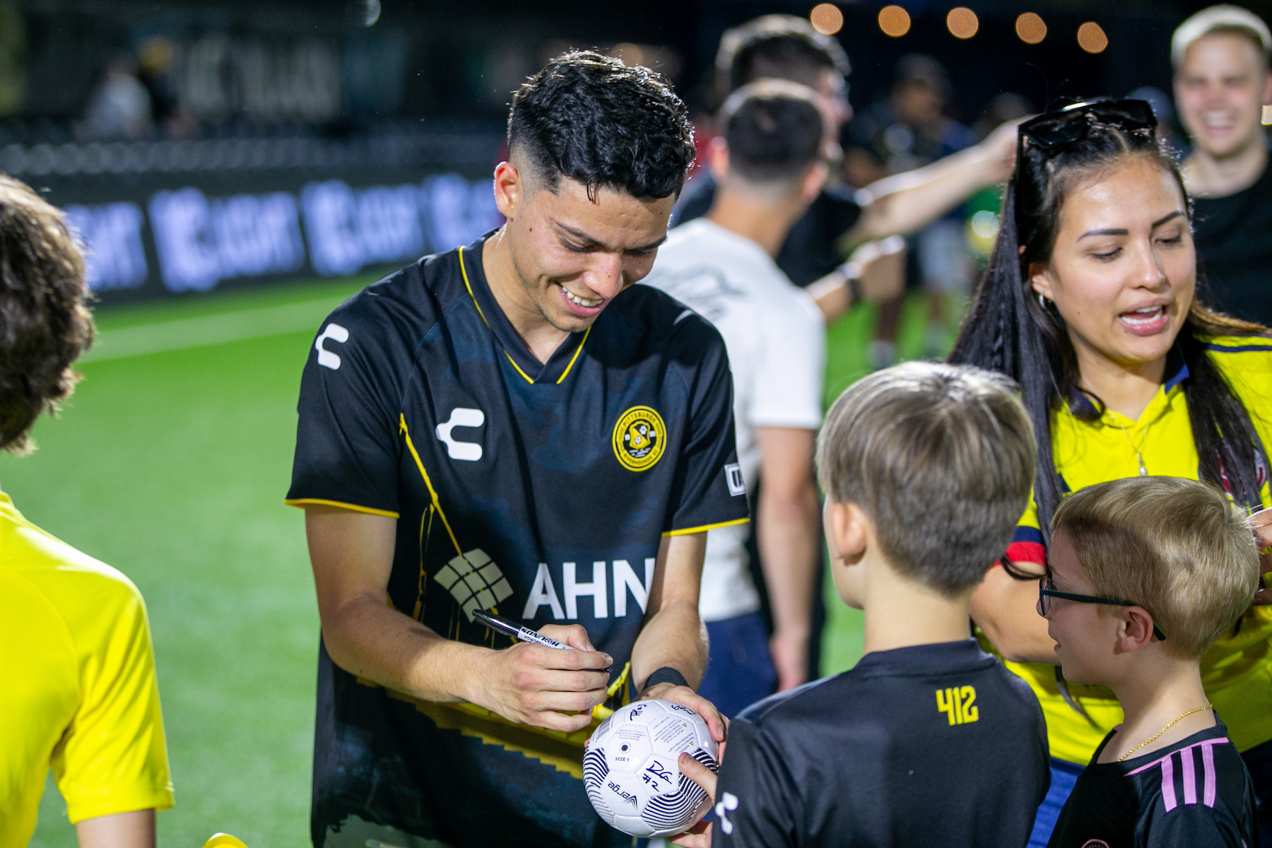 Dani Rovira signs an autograph for a fan after the Hounds' 2-0 win over Detroit City FC on April 27, 2024 at Highmark Stadium (Photo: Chris Cowger/Riverhounds SC)