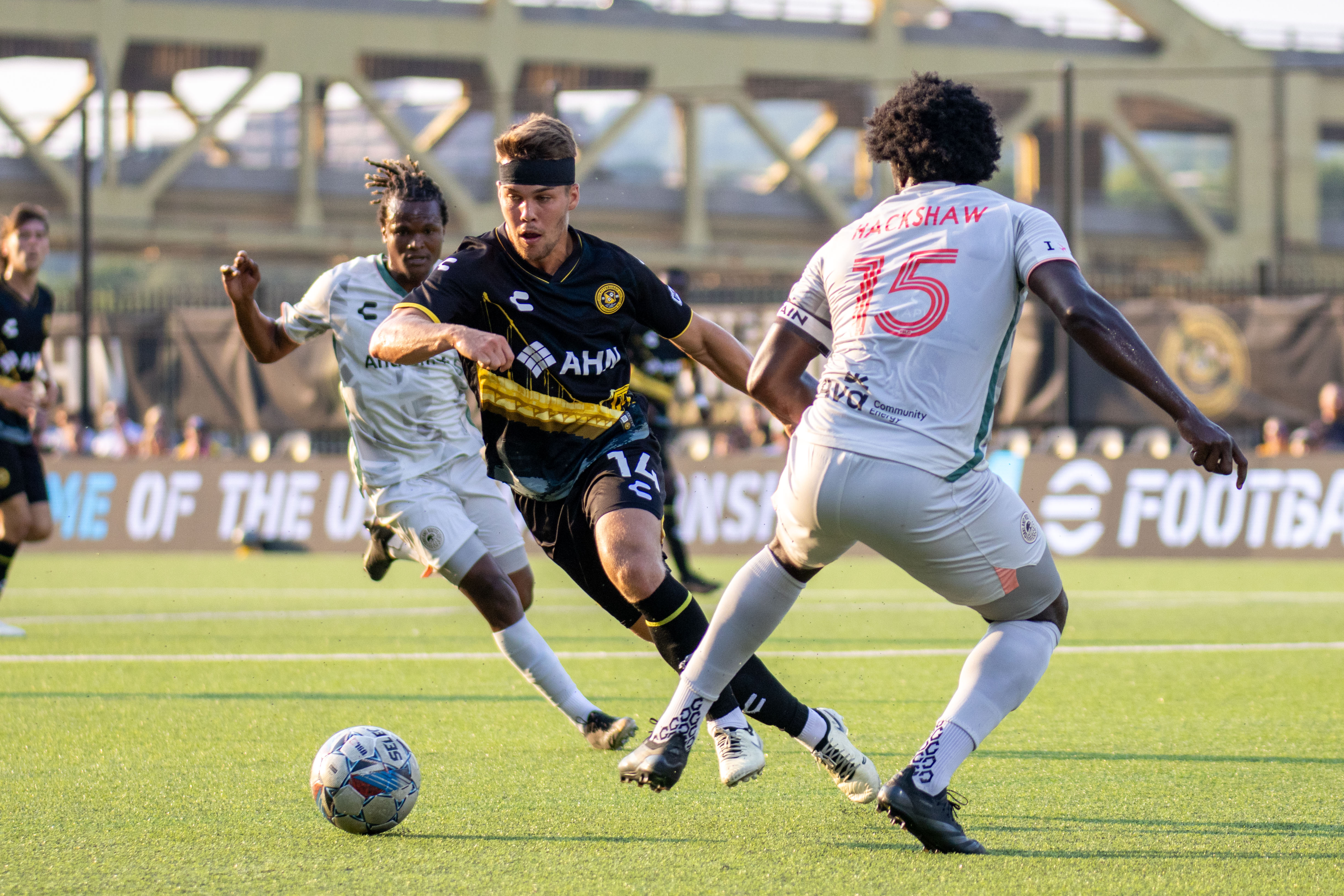 Robbie Mertz weaves between defenders in the Riverhounds' 5-0 win over Oakland Roots SC on July 13, 2024 at Highmark Stadium. (Photo: Chris Cowger/Pittsburgh Riverhounds SC)