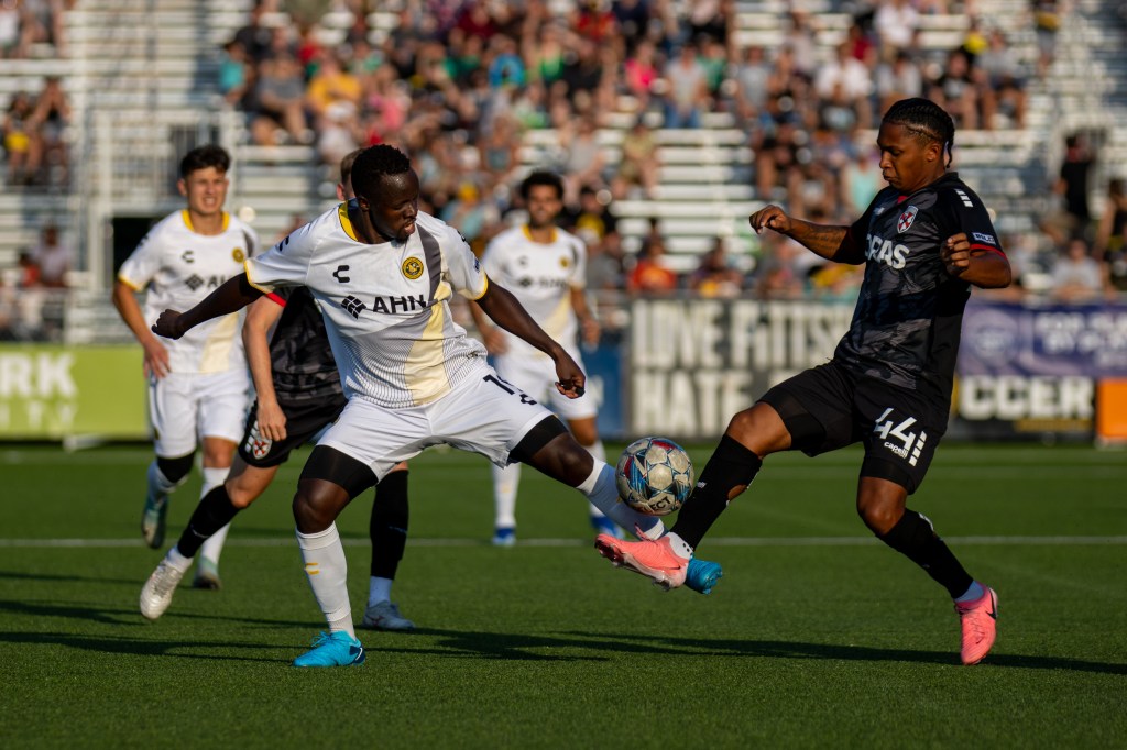 Edward Kizza challenges for the ball with Loudoun United FC's Isaiah Johnston in the Riverhounds' 1-1 draw July 27, 2024 at Highmark Stadium. (Photo: Chris Cowger/Riverhounds SC)