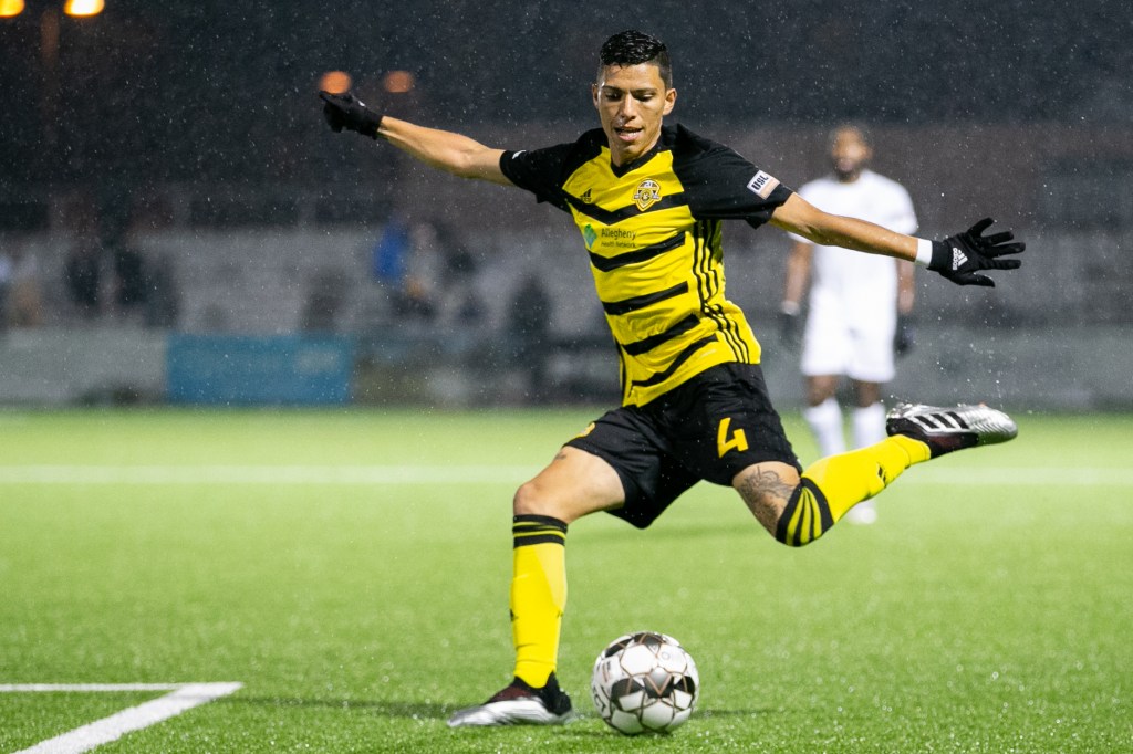 Dani Rovira crossing a ball in a game for the Pittsburgh Riverhounds at Highmark Stadium