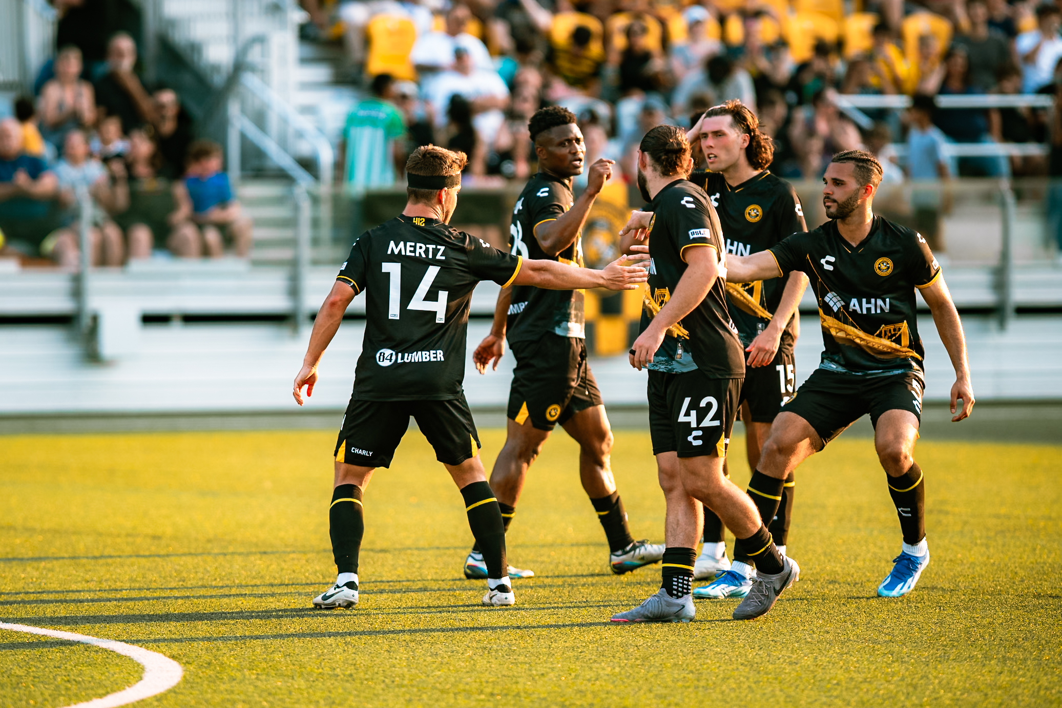 Riverhounds players celebrate after a goal in their 5-0 win over Oakland Roots SC on July 13, 2024 at Highmark Stadium (Photo: Ryan Shaffer/Pittsburgh Riverhounds SC)