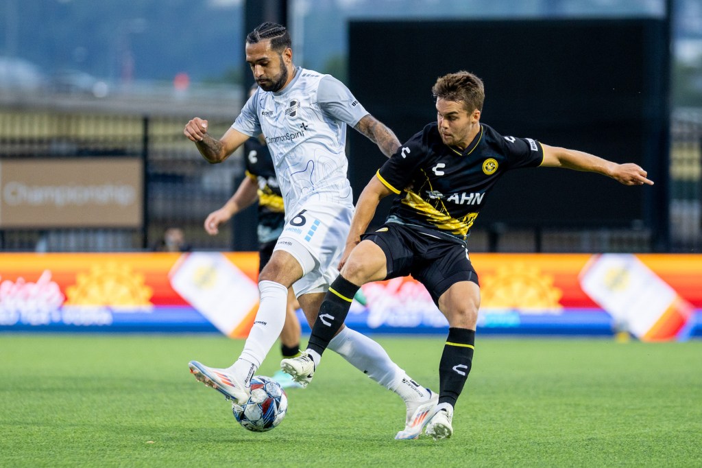 Riverhounds midfielder Robbie Mertz and Matt Real of the Colorado Springs Switchbacks battle for the ball in a 2-2 draw on Aug. 17, 2024 at Highmark Stadium. (Photo: Chris Cowger/Riverhounds SC)