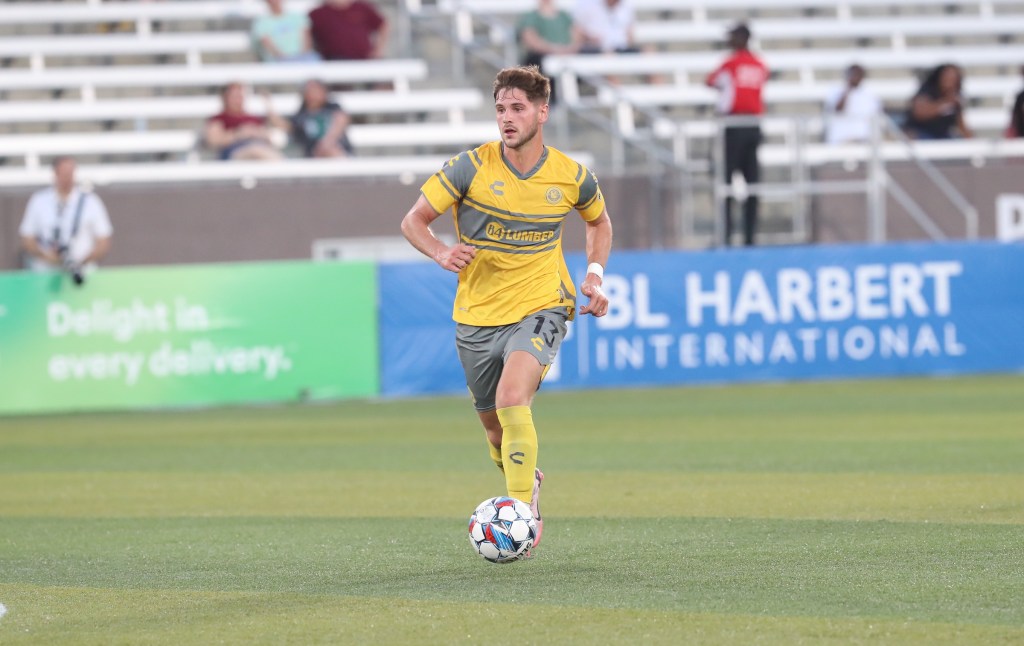 Luke Biasi dribbles the ball in the Riverhounds' 3-0 win over Birmingham Legion FC on Aug. 24, 2024, at Protective Stadium in Birmingham, Ala. (Photo courtesy of Birmingham Legion FC)