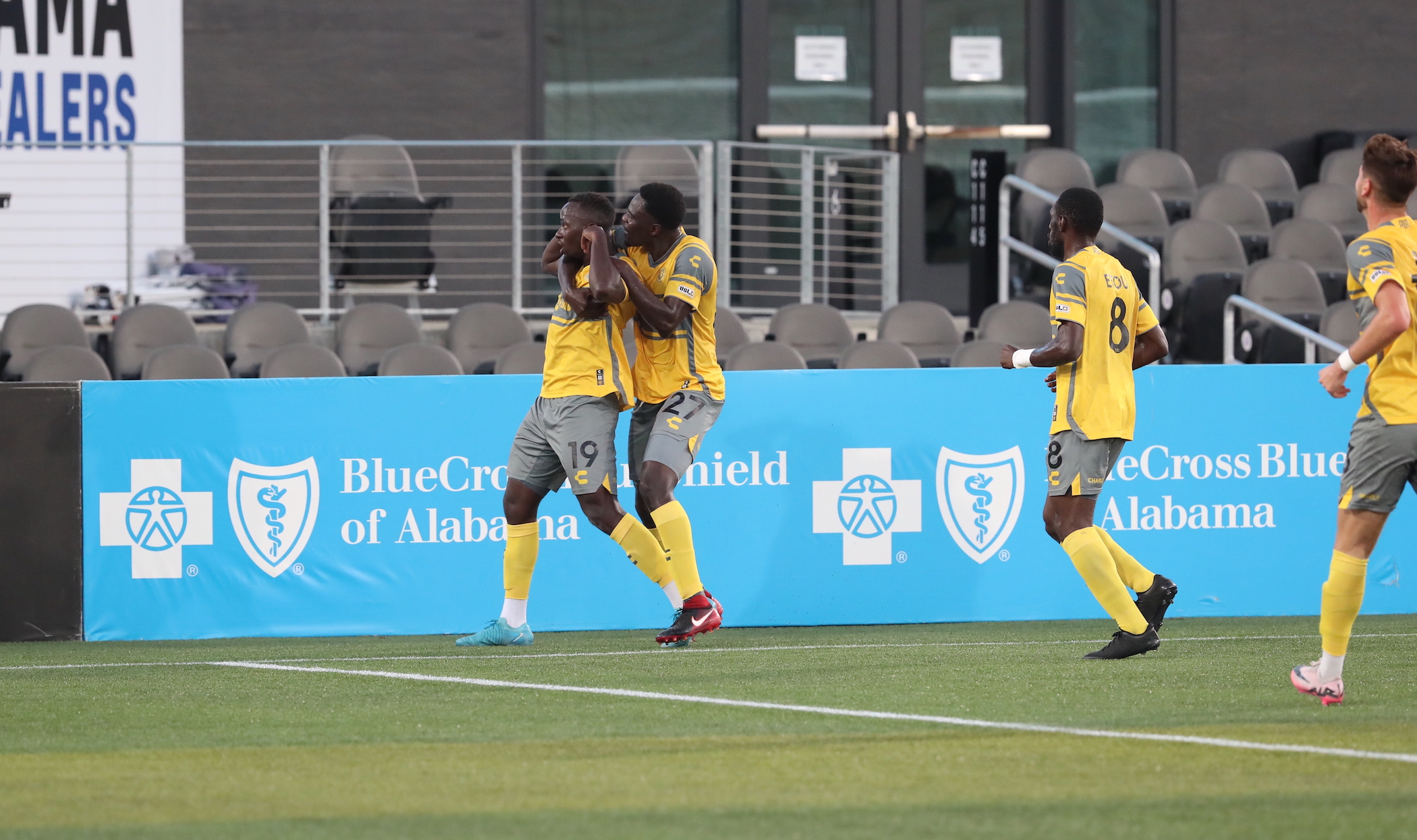 Babacar Diene hugs teammate Edward Kizza after Kizza scored the opening goal in the Riverhounds' 3-0 win over Birmingham Legion FC on Aug. 24, 2024 at Protective Stadium in Birmingham, Ala. (Photo courtesy of Birmingham Legion FC)