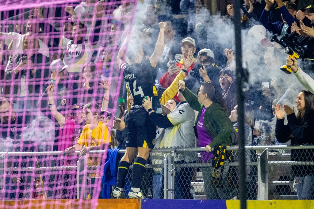 Robbie Mertz celebrates with fans in the Paul Child Stand after scoring in the Riverhounds' 2-0 win over the Charleston Battery on Oct. 12, 2024, at Highmark Stadium. (Photo: Chris Cowger/Riverhounds SC)