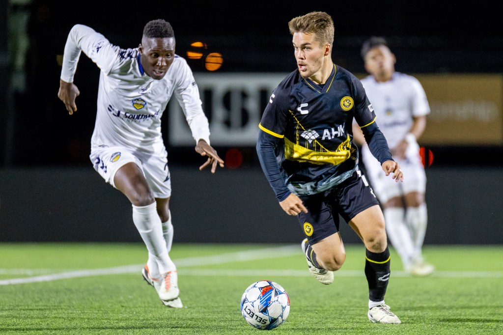 Riverhounds midfielder Robbie Mertz evades El Paso Locomotive FC midfielder Bolu Akinyode during the Hounds' 2-0 win Oct. 26, 2024, at Highmark Stadium. (Photo: Chris Cowger/Riverhounds SC)