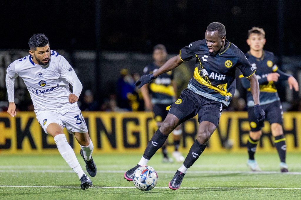 Riverhounds striker Edward Kizza dribbles away from El Paso Locomotive midfielder Robert Coronado in the Hounds' 2-0 win on Oct. 26, 2024, at Highmark Stadium. (Photo: Chris Cowger/Riverhounds SC)