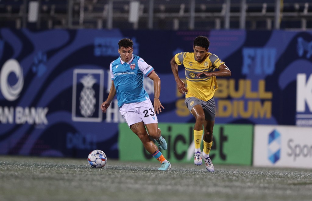 Riverhounds forward Bertin Jacquesson tracks down Miami FC midfielder Rocco Genzaro in the Hounds' 4-0 win on Oct. 5, 2024, at Pitbull Stadium in Miami. (Photo courtesy of Miami FC)