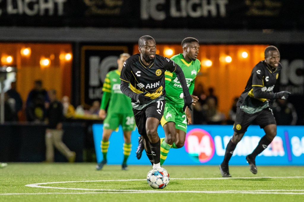 Kenardo Forbes looks upfield before passing against the Tampa Bay Rowdies in the Riverhounds' 0-0 draw on April 6, 2024, at Highmark Stadium. (Photo: Mallory Neil/Riverhounds SC)