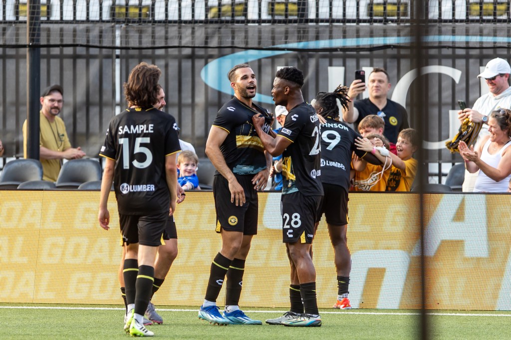 Teammates celebrate with Sean Suber after his first professional goal in the Hounds' 5-0 win over Oakland Roots SC on July 13, 2024, at Highmark Stadium. (Photo: Mallory Neil/Riverhounds SC)