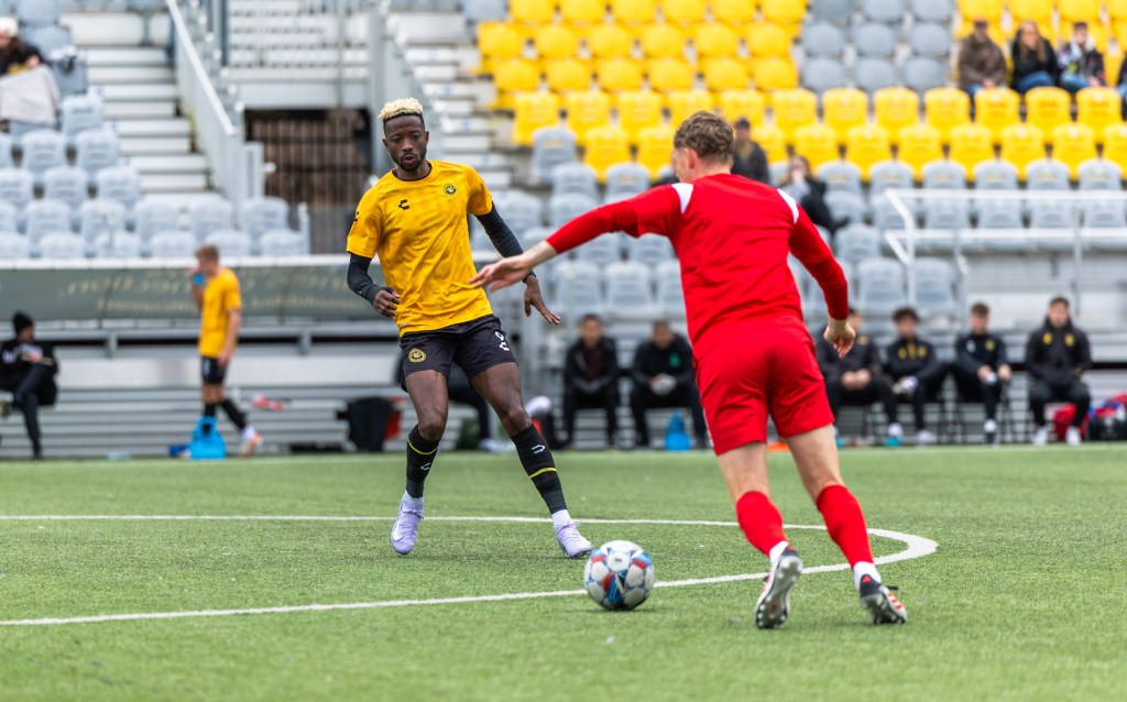 Riverhounds forward Augi Williams applies pressure on the ball in the team's preseason match against Loudoun United FC on Feb. 25, 2025 at Highmark Stadium. (Photo: Ryan Shaffer/Riverhounds SC)