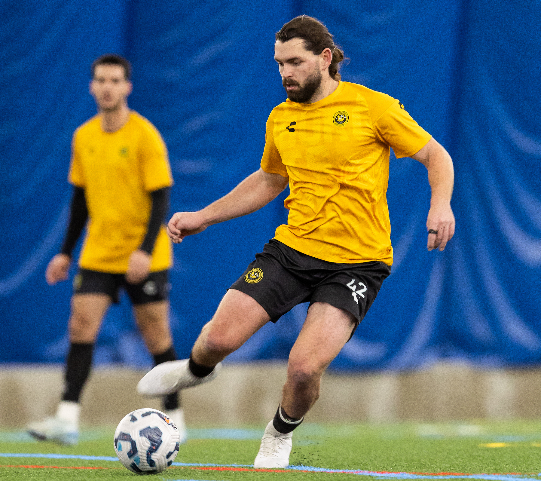 Jackson Walti controls the ball in midfield during the Riverhounds' 3-0 win over Pitt on Feb. 21, 2025, at the Pitt Sports Dome. (Photo: Mallory Neil/Riverhounds SC)